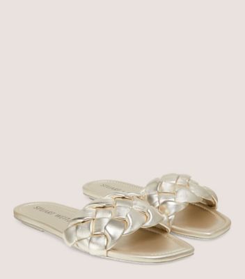 Stuart Weitzman,BRAIDA FLAT SLIDE,Slide,Liquid Metallic Leather,Light Gold,Angle View