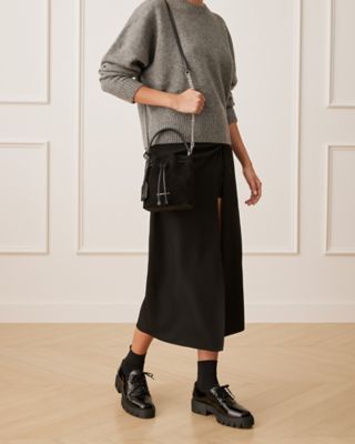 Stuart Weitzman,RAE MINI BUCKET BAG,Bucket bag,Textured Suede & Snake,Black,Shoe on tall model